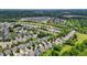 Aerial view of homes in a well-planned neighborhood with tree-lined streets and manicured lawns at 2067 Glenkirk Dr, Burlington, NC 27215
