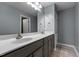 Bathroom with double sinks and light wood style tile floors at 2067 Glenkirk Dr, Burlington, NC 27215