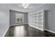 Serene bedroom featuring a built-in bookshelf and large window at 2067 Glenkirk Dr, Burlington, NC 27215