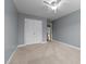 Bedroom with neutral carpet, closet, and open door to another room at 2067 Glenkirk Dr, Burlington, NC 27215