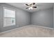 Bedroom with windows and carpet at 2067 Glenkirk Dr, Burlington, NC 27215
