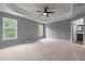 A spacious bedroom featuring a ceiling fan and windows at 2067 Glenkirk Dr, Burlington, NC 27215