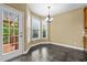 Cozy dining area with bay windows and access to a deck at 2067 Glenkirk Dr, Burlington, NC 27215