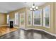 Bright dining area featuring bay windows, deck access, and tile flooring at 2067 Glenkirk Dr, Burlington, NC 27215