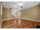 Open-concept living area with hardwood floors, staircase, and ample natural light at 2067 Glenkirk Dr, Burlington, NC 27215