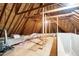View of unfinished attic space with HVAC and wooden beams at 209 Bailey Ridge Dr, Morrisville, NC 27560