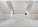 Large attic space featuring carpet, sloped ceilings, and window seat at 209 Bailey Ridge Dr, Morrisville, NC 27560
