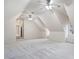 Large attic space featuring carpet, windows, and ceiling fans at 209 Bailey Ridge Dr, Morrisville, NC 27560