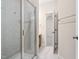 Well-lit bathroom featuring glass shower and neutral wall paint at 209 Bailey Ridge Dr, Morrisville, NC 27560
