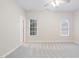 Bright bedroom featuring neutral walls, carpet, and a ceiling fan at 209 Bailey Ridge Dr, Morrisville, NC 27560