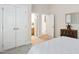 Bedroom featuring double closets, view to bathroom and laundry room at 209 Bailey Ridge Dr, Morrisville, NC 27560