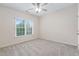 Well-lit bedroom with neutral walls, carpeted floor and bright windows at 209 Bailey Ridge Dr, Morrisville, NC 27560