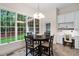 Bright breakfast nook with table and chair set in front of large window with backyard views at 209 Bailey Ridge Dr, Morrisville, NC 27560