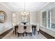 Elegant dining room with tray ceiling, chandelier, and wainscoting at 209 Bailey Ridge Dr, Morrisville, NC 27560