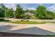 Well-manicured front yard with mature trees framing a beautiful single Gathering home at 209 Bailey Ridge Dr, Morrisville, NC 27560