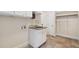 Laundry room featuring sink, cabinets, and storage shelves at 209 Bailey Ridge Dr, Morrisville, NC 27560