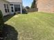 Expansive backyard with healthy green grass and a screened-in porch at 2535 Kinglass Dr, Fuquay Varina, NC 27526