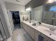 Well-lit primary bathroom with double sinks and walk-in closet at 2535 Kinglass Dr, Fuquay Varina, NC 27526