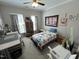 Cozy bedroom with ceiling fan, window views, and decor at 2535 Kinglass Dr, Fuquay Varina, NC 27526