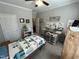 Serene bedroom with ceiling fan, closet access, and ample sunlight at 2535 Kinglass Dr, Fuquay Varina, NC 27526