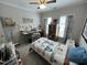 Inviting bedroom featuring a ceiling fan, natural lighting, and wood furniture at 2535 Kinglass Dr, Fuquay Varina, NC 27526