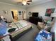 Relaxing bedroom featuring cozy chair and TV at 2535 Kinglass Dr, Fuquay Varina, NC 27526