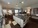 Spacious open-concept kitchen featuring a center island, hardwood floors, and eat-in dining area at 2535 Kinglass Dr, Fuquay Varina, NC 27526