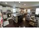 Open concept kitchen featuring modern appliances, granite countertops, and a center island at 2535 Kinglass Dr, Fuquay Varina, NC 27526