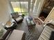 Cozy sunroom with tile floors, wicker furniture, and a view of the backyard at 2535 Kinglass Dr, Fuquay Varina, NC 27526