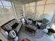 Relaxing sunroom featuring wicker furniture, a patterned rug, and abundant natural light at 2535 Kinglass Dr, Fuquay Varina, NC 27526