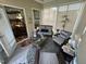 Bright sunroom with wicker seating, tile floor, and access to kitchen at 2535 Kinglass Dr, Fuquay Varina, NC 27526