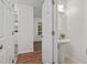 Cozy bathroom featuring a pedestal sink and neutral color palette at 2724 Glastonbury Rd, Apex, NC 27539