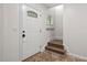Bright entryway with tiled floors and a small staircase at 2724 Glastonbury Rd, Apex, NC 27539