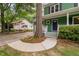 A green home featuring a white porch railing, and a purple front door at 2724 Glastonbury Rd, Apex, NC 27539