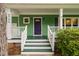 The front door features a purple door, white handrails, and green painted stairs at 2724 Glastonbury Rd, Apex, NC 27539