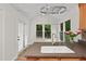 Kitchen with a granite countertop, a stainless steel faucet, and white cabinets at 2724 Glastonbury Rd, Apex, NC 27539