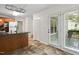 Bright kitchen with a door to the backyard and coordinating tile flooring at 2724 Glastonbury Rd, Apex, NC 27539