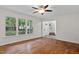 Open living room with wood floors and natural light at 2724 Glastonbury Rd, Apex, NC 27539
