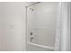 Clean white shower-tub combo with shower head, faucet, and curtain at 2724 Glastonbury Rd, Apex, NC 27539