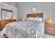 Bright bedroom featuring a large bed, wooden furniture, and ample natural light at 3027 Courtney Creek Blvd, Durham, NC 27713