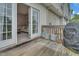 Spacious deck with grill and open French doors leading inside, offering a seamless indoor-outdoor living experience at 3027 Courtney Creek Blvd, Durham, NC 27713