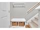 Functional entryway features storage bench with baskets, coat rack, and staircase, blending style with convenience at 3027 Courtney Creek Blvd, Durham, NC 27713