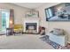 Cozy living room featuring a fireplace and comfortable seating with natural light at 3027 Courtney Creek Blvd, Durham, NC 27713
