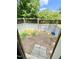 Fenced backyard offers secure space, partial shade, steps, and blue water bowl at 304 Sandalwood Ave, Louisburg, NC 27549