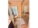 Bathroom boasts tiled walk-in shower with glass door, decorative rugs, and built-in storage at 304 Sandalwood Ave, Louisburg, NC 27549