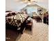 Comfortable bedroom with stylish bedding, ceiling fan, chair, and dresser at 304 Sandalwood Ave, Louisburg, NC 27549