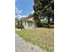 Cozy home with large windows, set on a lot featuring mature trees and gravel path at 304 Sandalwood Ave, Louisburg, NC 27549