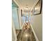 Long hallway with wood flooring, recessed lighting, and tastefully framed artwork at 304 Sandalwood Ave, Louisburg, NC 27549
