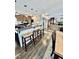 Kitchen island with barstool seating featuring granite counters and modern pendant lighting at 304 Sandalwood Ave, Louisburg, NC 27549