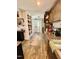 Galley style kitchen with access to a laundry room featuring granite counters and appliances at 304 Sandalwood Ave, Louisburg, NC 27549